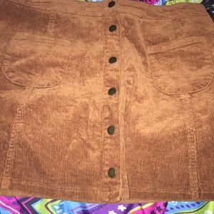 Melville tan button up skirt.